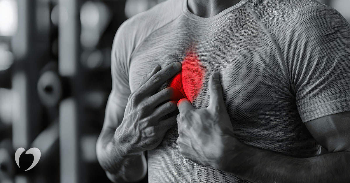 athlete holding his chest to indicate a heart issue